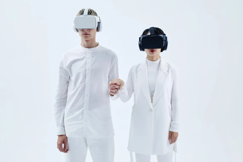 a man and a woman wearing virtual reality headsets, an album cover, unsplash, renaissance, white clothing, photographed for reuters, navy, no - text no - logo