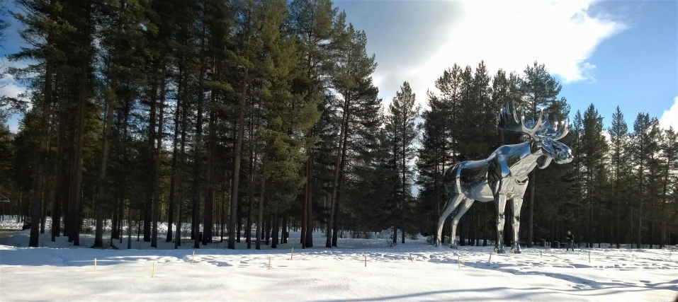 a statue of a deer in the middle of a snow covered field, a surrealist sculpture, inspired by Eero Järnefelt, 🌲🌌, dense coniferous forest. spiders, sci - fi mongolian village, skiing