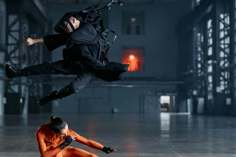 a couple of people that are in the air, inspired by Maciej Kuciara, pexels contest winner, neo-figurative, mocap, action scene from kill bill, futuristic techwear, getty images proshot