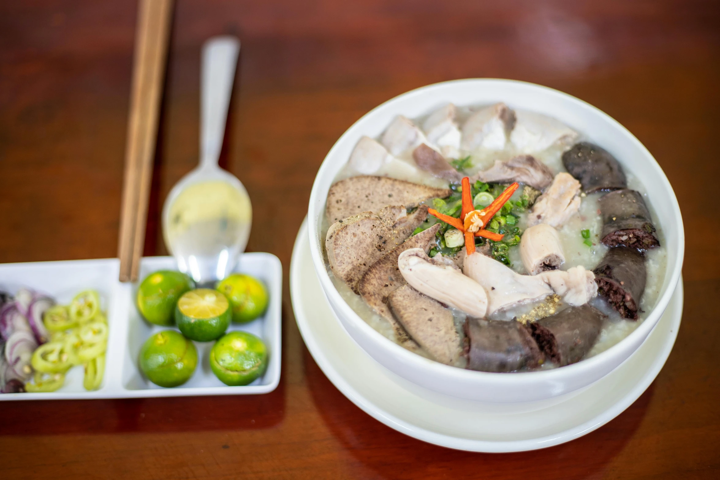 a bowl of soup sitting on top of a wooden table, inspired by Tan Ting-pho, chicken, square, high-quality photo, background image