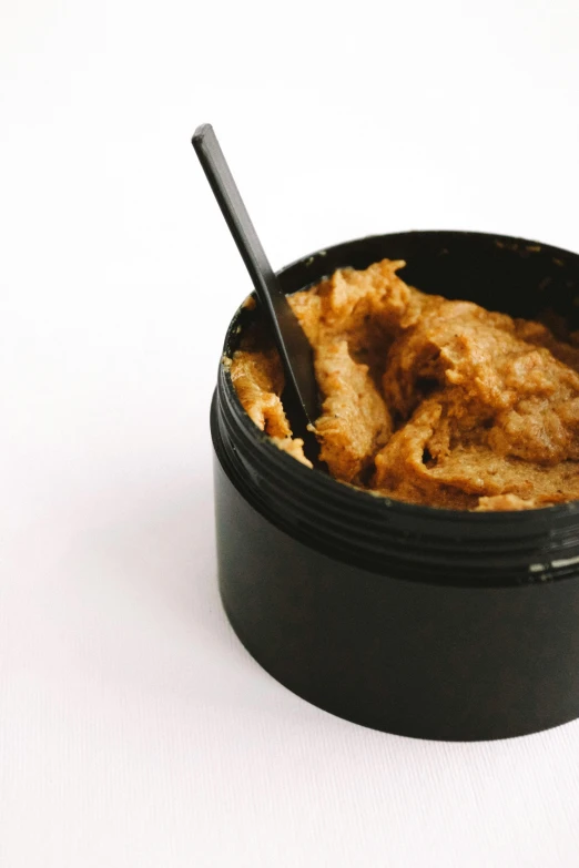 a bowl of peanut butter with a spoon in it, renaissance, dirt - stained skin, ap news photo, lush, in 2 0 1 5