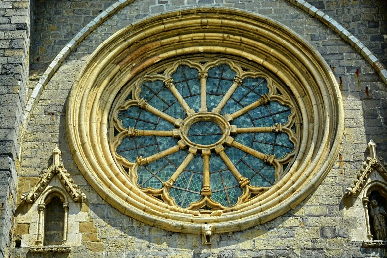 a clock that is on the side of a building, inspired by Barthélemy d'Eyck, romanesque, photo of a beautiful window, round-cropped, stone and glass and gold, cathedrals
