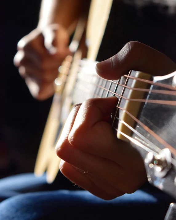 a close up of a person playing a guitar, an album cover, pexels contest winner, happening, lgbtq, no cropping, thumbnail, multiple stories