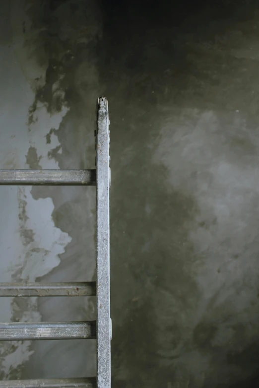 a ladder leaning against a wall in a room, by Elsa Bleda, conceptual art, scratched metal, video still, concrete ), contain