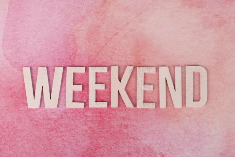 a pink watercolor background with the word weekend written on it, pixabay, wooden, posed, sam shearon, festivals