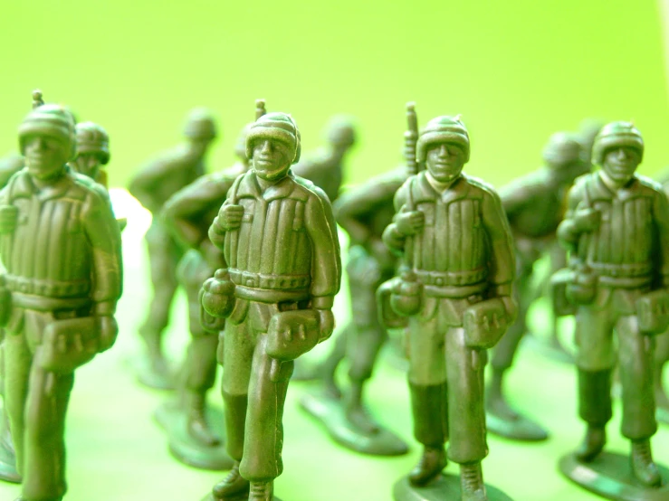 a group of toy soldiers standing next to each other, wearing green, zoomed in, militarism, screensaver