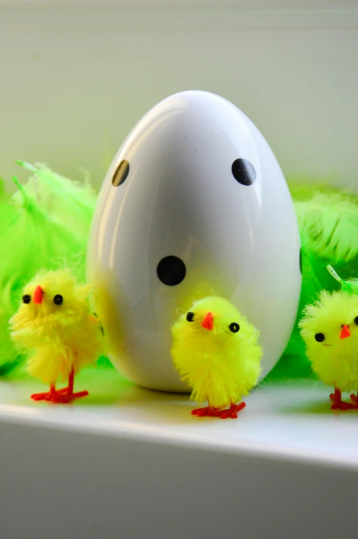 a group of chicks standing next to an egg, flickr, with fluo colored details, green feathers, with a white, stuffed