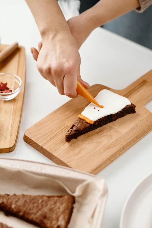 a person cutting a piece of cake on a cutting board, inspired by Jan Kupecký, wooden magic wand, visually crisp & clear, gourmet cooking, over the shoulder