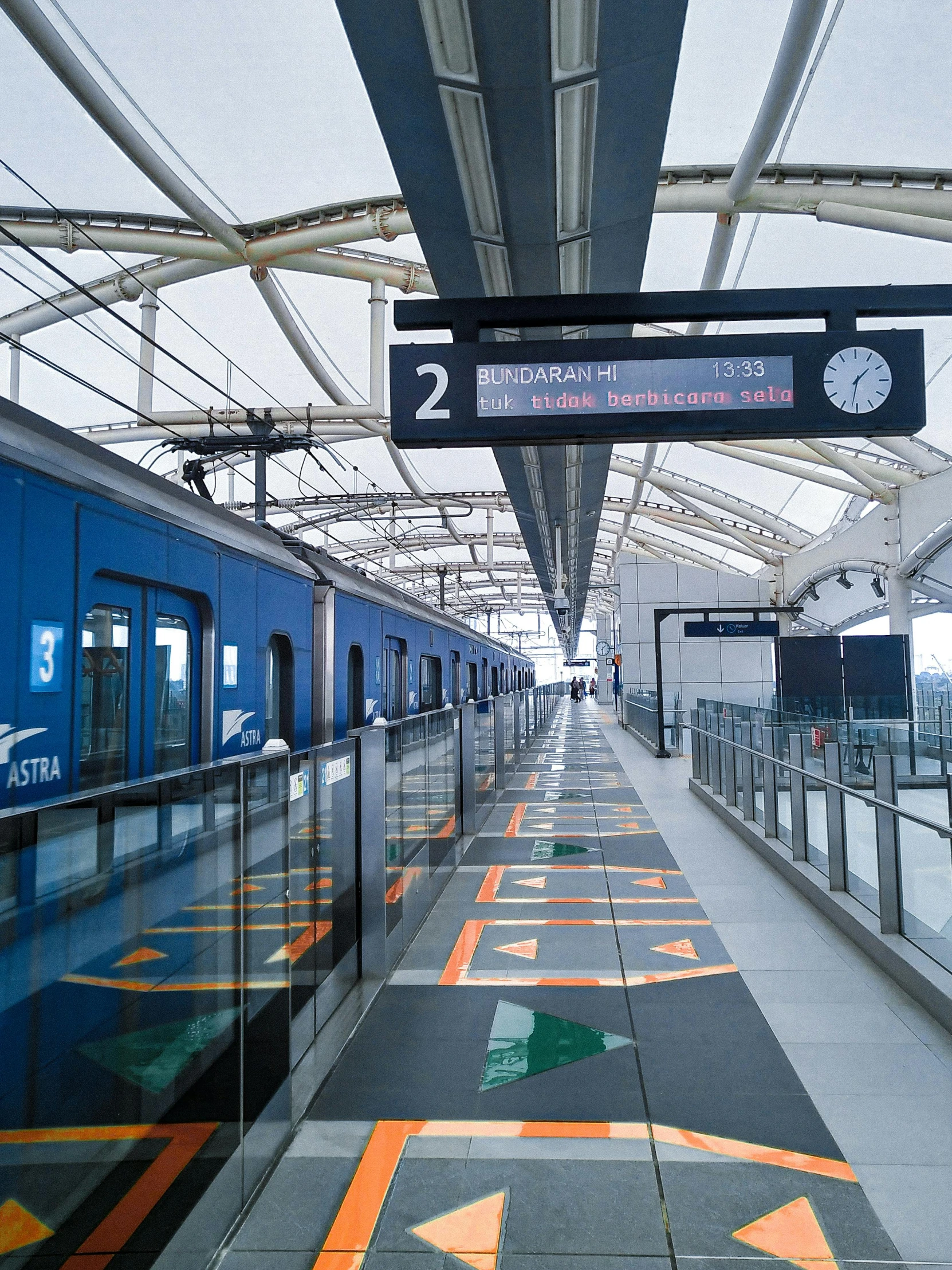 a blue train pulling into a train station, in future airport rooftop, 2022 photograph, floor b2, ligne claire