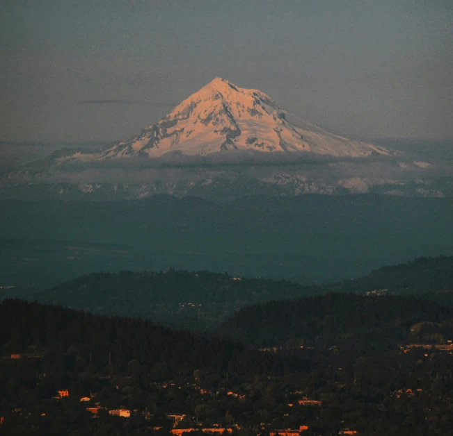 a view of a snow covered mountain in the distance, by Morgan Russell, unsplash contest winner, renaissance, portland oregon, ☁🌪🌙👩🏾, last light on mountain top, still frame the retro twin peaks