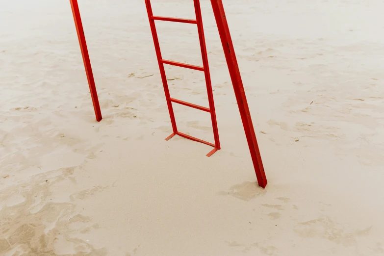 a red ladder sitting on top of a sandy beach, inspired by Robert Bechtle, pexels contest winner, playground, alessio albi, rectangle, 10k