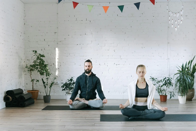 a man and a woman doing yoga together, a portrait, trending on unsplash, light and space, background image, 8k hq, open room, low quality photo