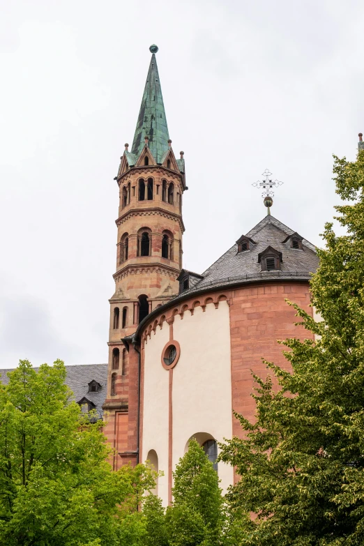 a tall tower with a clock on top of it, inspired by Rainer Maria Latzke, romanesque, lead - covered spire, exterior shot, photograph taken in 2 0 2 0, panorama