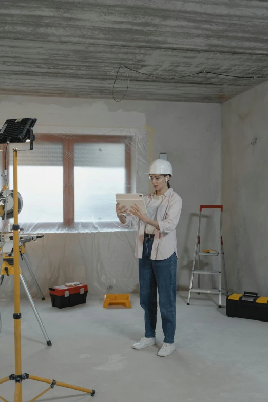 a couple of people that are standing in a room, construction, profile image, video, woman