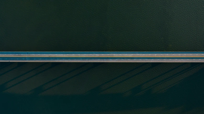 a bird's eye view of a bridge over a body of water, by Jacob Toorenvliet, unsplash contest winner, conceptual art, 2d minimalism, scanlines, color highway, hyperrealistic n- 4