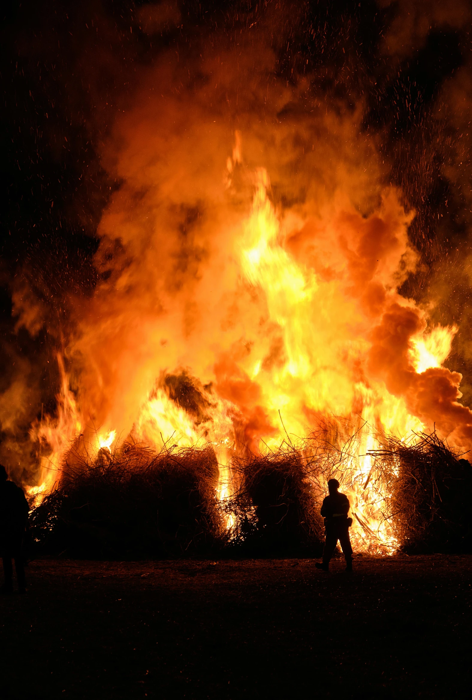 a group of people standing in front of a fire, during the night, profile image, the wicker man, multiple stories