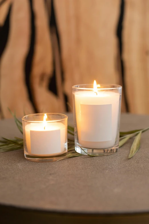 a couple of candles sitting on top of a table, a picture, square, pristine and clean, product display photograph, close medium shot