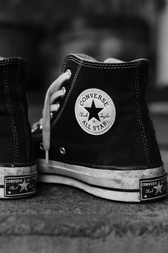 black and white photograph of a pair of converse sneakers, by Altichiero, rugged | stars, rock n roll, made of glazed, so come on