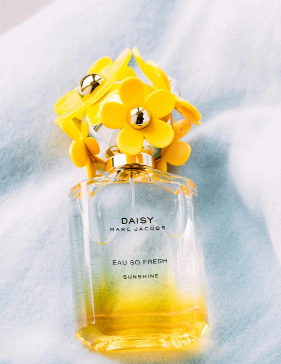 a bottle of marc marc marc marc marc marc marc marc marc marc marc marc marc marc marc, by Ellen Gallagher, unsplash, crystallic sunflowers, detailed product image, carrying a bottle of perfume, set against a white background