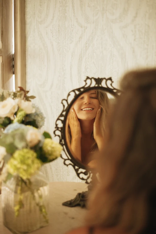 a woman that is standing in front of a mirror, smiling laughing, wedding, hands shielding face, brown