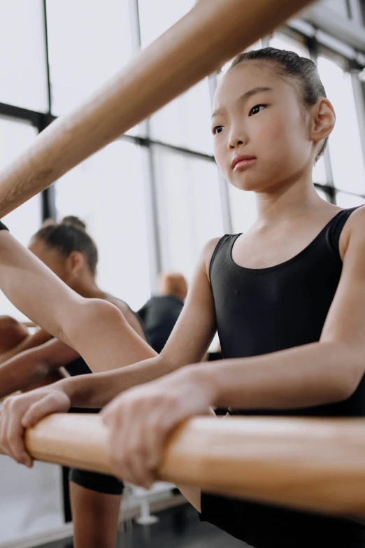 a young girl in a black leo leo leo leo leo leo leo leo leo leo leo leo, trending on pexels, arabesque, nanae kawahara, working out, looking sad, ( ( theatrical ) )