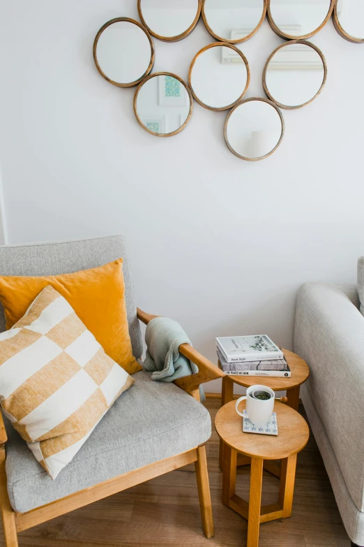 a living room filled with furniture and mirrors, inspired by Constantin Hansen, trending on unsplash, light and space, some sandy yellow pillows, reading nook, medium close up shot, white bg