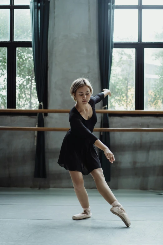 a woman in a black dress is dancing, a portrait, by Mei Qing, unsplash, arabesque, cinematic. by leng jun, full body cute young lady, at home, compassionate