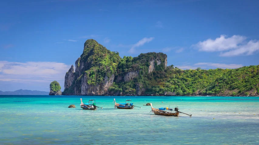 a group of boats floating on top of a body of water, pexels contest winner, romanticism, tropical background, thai, avatar image, uk