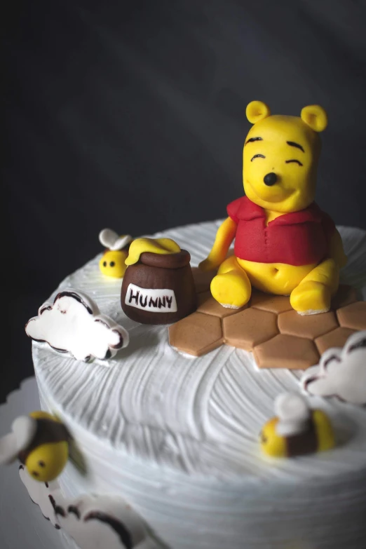 a cake with a winnie the pooh figurine on top of it, pexels, process art, 3 d bee, close up high detailed, paul barson, slide show