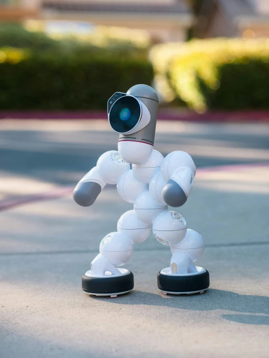 a close up of a toy robot on a street, sassy pose, salvia droid, full device, explorer