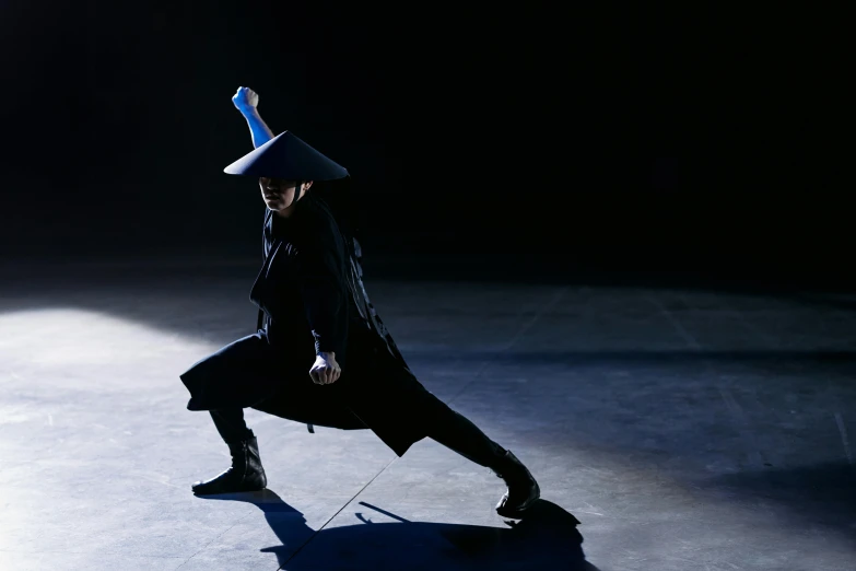 a man in a hat doing a trick on a skateboard, inspired by Fei Danxu, holding a spectacular broadsword, issey miyake, dramatic blue lighting, avatar image