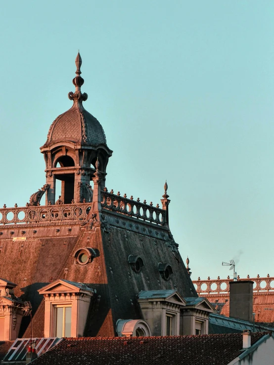 a clock that is on the side of a building, turrets, in a rooftop, taken at golden hour, rococo architecture