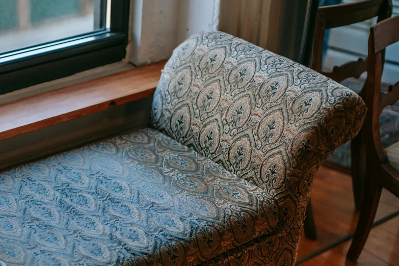 a chair that is sitting in front of a window, paisley, furniture, thumbnail, benches