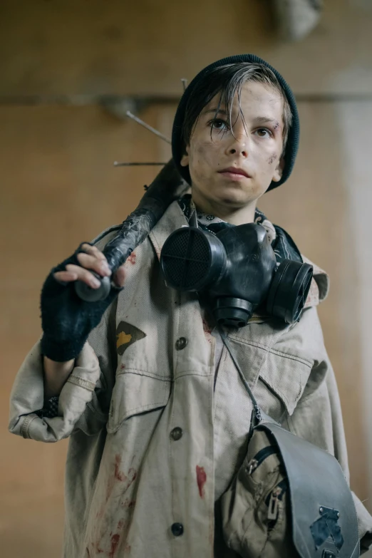 a woman wearing a gas mask holding a pair of scissors, unsplash, bauhaus, still from stranger things, wearing tactical gear, young boy, battle damaged
