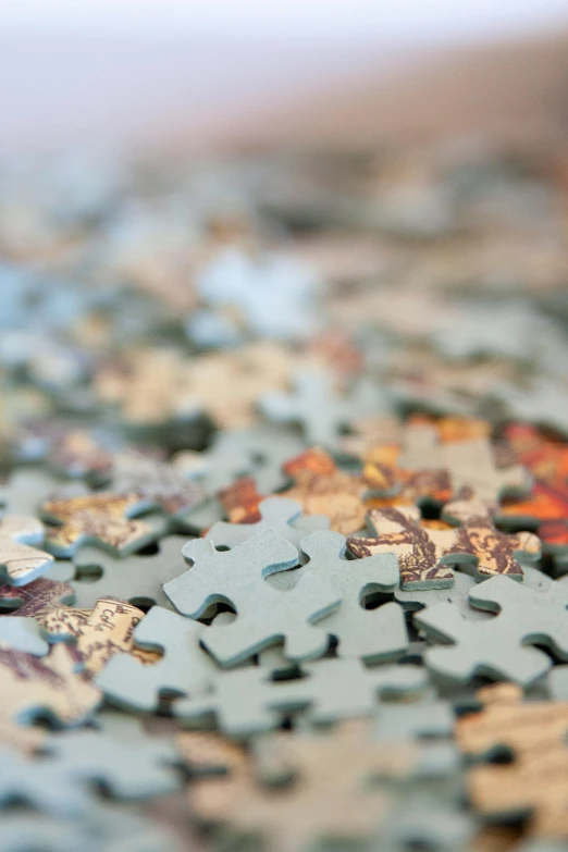 a pile of puzzle pieces sitting on top of a table, a jigsaw puzzle, by Paul Davis, unsplash, 2 5 6 x 2 5 6 pixels, painstaking detail, patterned, curated collections
