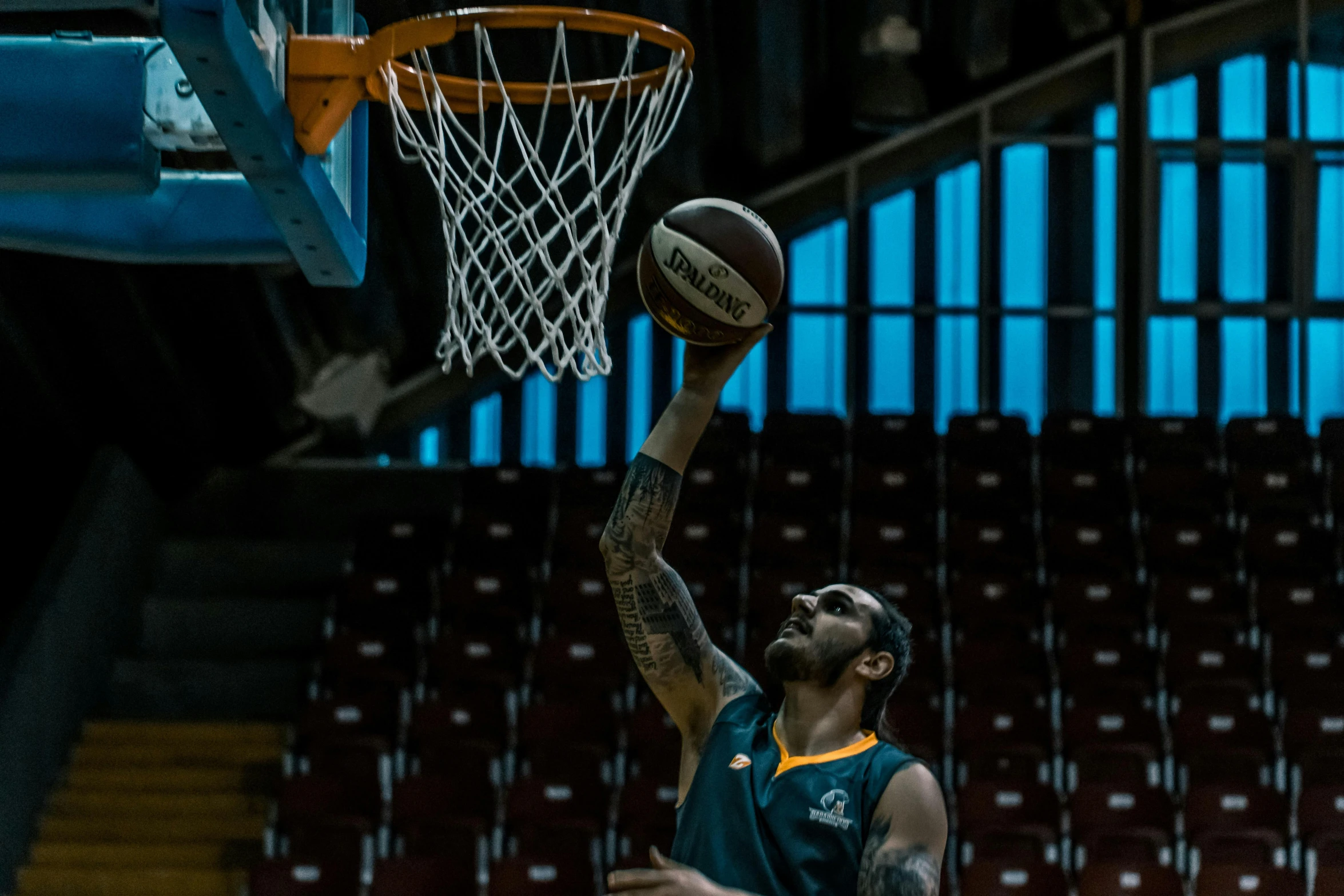 a basketball player getting ready to dunk the ball, liam brazier, shot on 1 5 0 mm, square, advertising photo