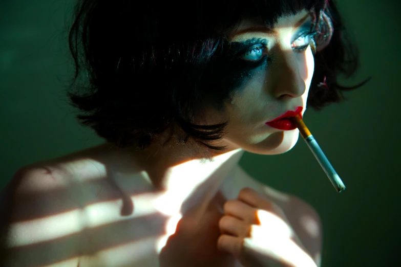 a woman with a cigarette in her mouth, inspired by Elsa Bleda, art photography, mary louise brooks is half robot, holding syringe, sensual lighting, hyper color photograph