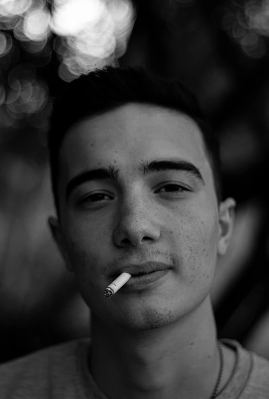 a man with a cigarette in his mouth, a black and white photo, by Alexis Grimou, realism, hyperrealistic teen, 2 0 years old, ((portrait)), icon black and white