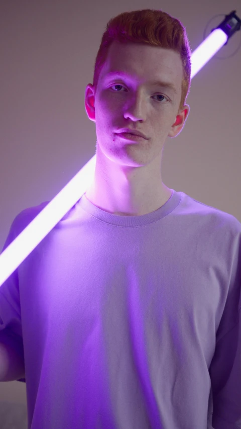 a young man holding a purple light saber, by Peter Alexander Hay, albino white pale skin, demna gvasalia, promo image, genderless