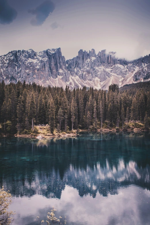 a lake with a mountain in the background, pexels contest winner, romanticism, tall pine trees, majestic spires, deep colours. ”, 5 0 0 px