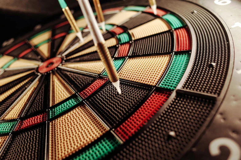 a close up of a dart on a dart board, by Tom Wänerstrand, pexels contest winner, hyperrealism, intricate embroidery, target reticles, duel, sports photo