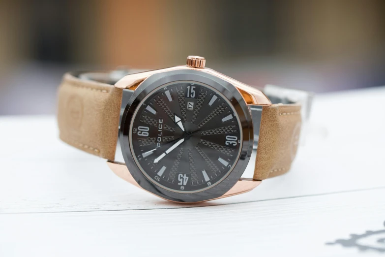 a watch sitting on top of a piece of paper, profile image, black and brown, argos, rose gold
