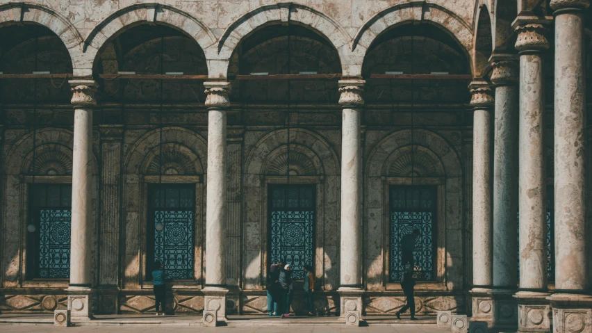 a group of people standing in front of a building, pexels contest winner, neoclassicism, turkey, steel archways, unsplash photo contest winner, islamic