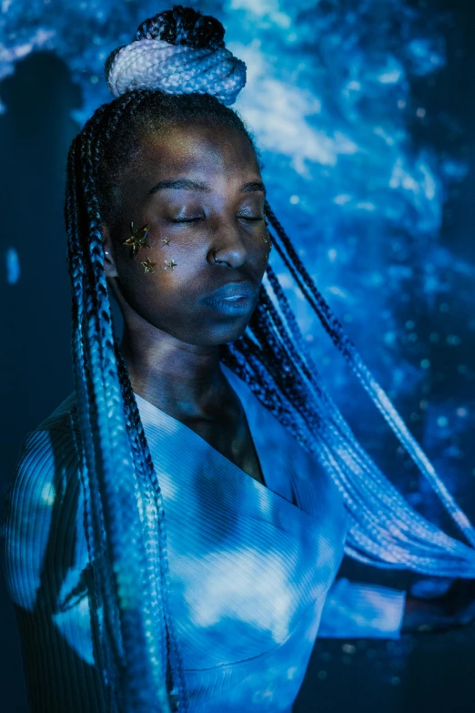 a woman with blue hair and a crown on her head, pexels contest winner, afrofuturism, braided hair. nightime, water is made of stardust, teamlab, portrait of tall