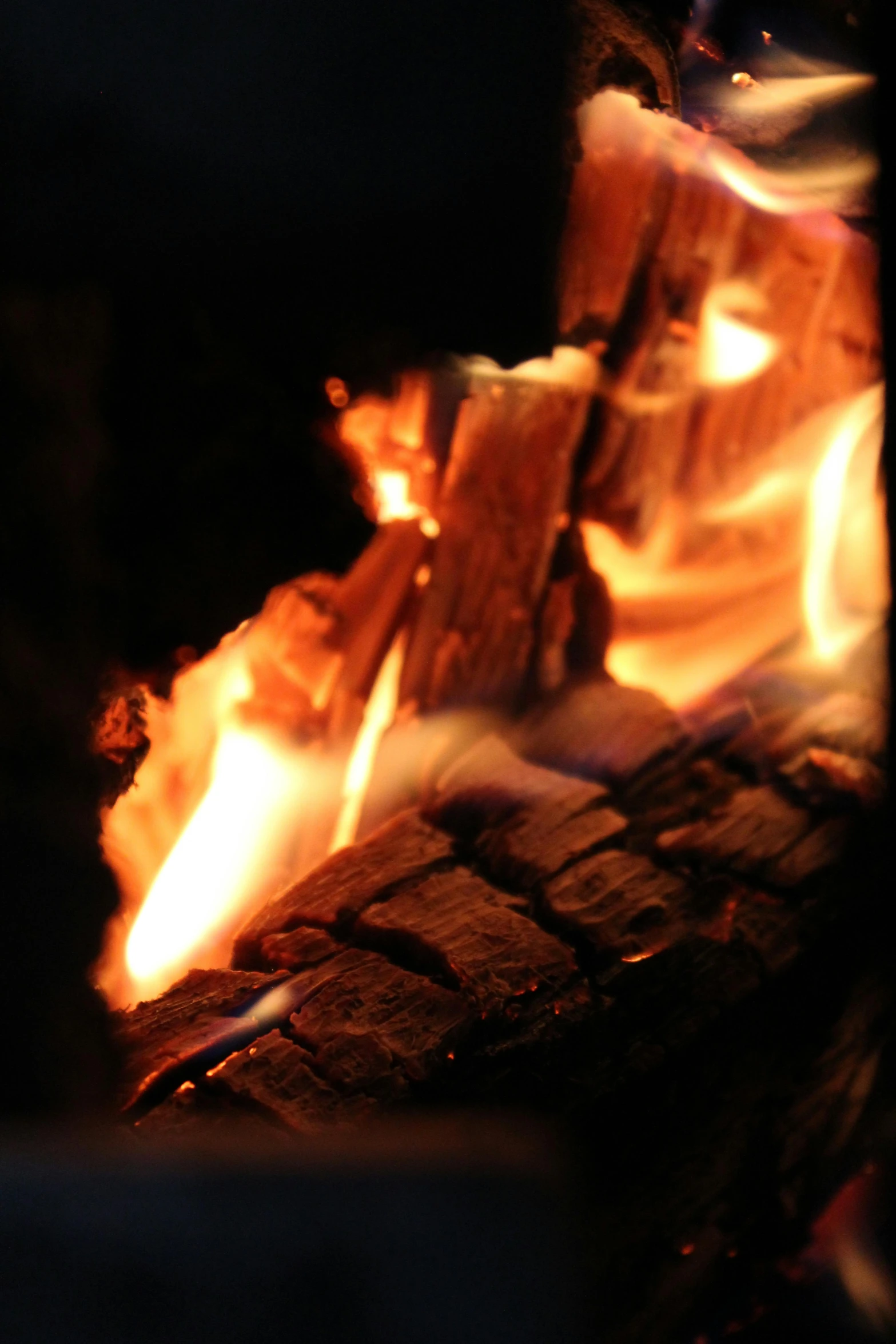 a close up of a fire in the dark, warm wood, delightful surroundings, breath taking, warm coloured