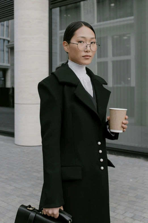 a woman walking down a sidewalk holding a cup of coffee, inspired by Feng Zhu, neo-dada, wearing black coat, & jeehyung lee & wlop, bella poarch, formal wear