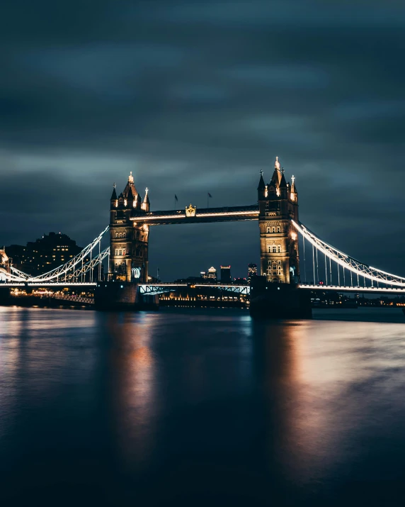 the tower bridge is lit up at night, an album cover, pexels contest winner, lgbtq, how pretty, thumbnail, multiple stories