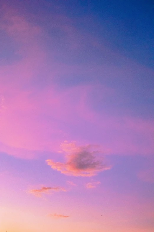 a couple of boats floating on top of a body of water, by Doug Ohlson, aestheticism, sherbert sky, soft light - n 9, pink and purple, pretty clouds