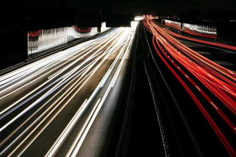 a highway filled with lots of traffic at night, a picture, unsplash, visual art, red and white lighting, shafts of light, instagram photo, full frame image