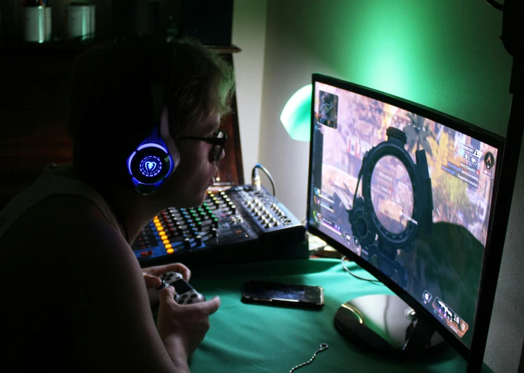 a woman sitting in front of a computer with headphones on, a portrait, inspired by Jules Chéret, reddit, video game control, mid shot photo, green crt monitors, playing board games